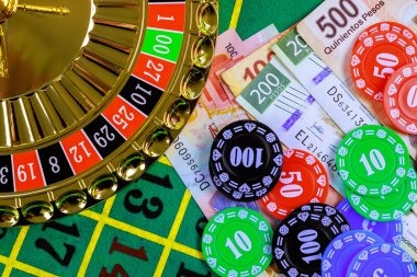 Bonus wheel feature in Mega Moolah showing four colored jackpot tiers with accumulating prize pools